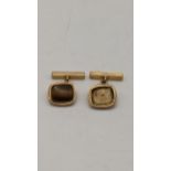 A pair of 9ct gold cufflinks, one with a missing stone, 7.45g Location: