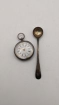 A silver engraved pocket watch having circular enamel face decorated with flowers and foliage with