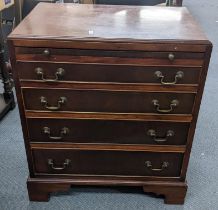 A reproduction Georgian inspired mahogany gentleman's chest having a brush slide and four drawers