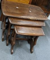 A mid 20th century Ercol nest of three dark elm stained tables Location: