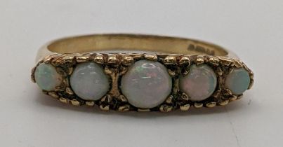 A 9ct gold opal ring set with five stones Location: