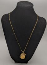 9ct gold pendant half sovereign necklace with a surround surmounted with a wild cat design, total