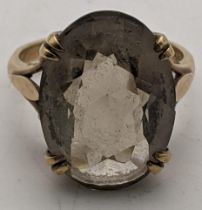 A 9ct gold ring set with a smoky quartz, 5.4g size M Location: