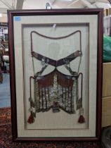A North African/Arabian peninsular, elaborately decorated and framed yashmak with tassels, Location
