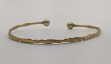 A 9ct gold bangle, 6.1g Location: