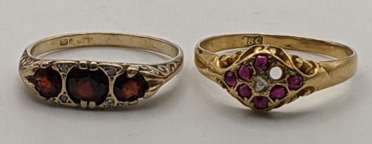 An 18ct gold set ring with a diamond and rubies, one missing, 2.85g and a 9ct gold ring set with