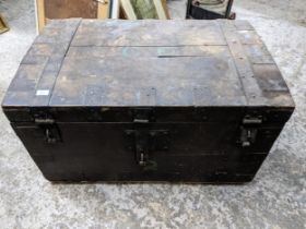 A 19th century wooden travelling chest with iron bound straps and carrying handles 55cm x 94cm x