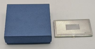 A silver Mappin & Webb card case having an engine turned front, hallmarked Birmingham 2014, 58.6g,