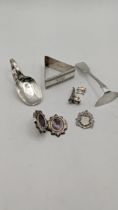 Mixed silver to include a Victorian sterling silver locket A/F, a silver tea caddy spoon, pusher,