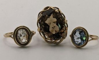 Three 9ct gold rings, each set with a coloured stone, 8.2g Location: