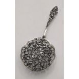 A late 19th/early 20th century Dutch silver pierced spoon having floral decoration 55.4g Location: