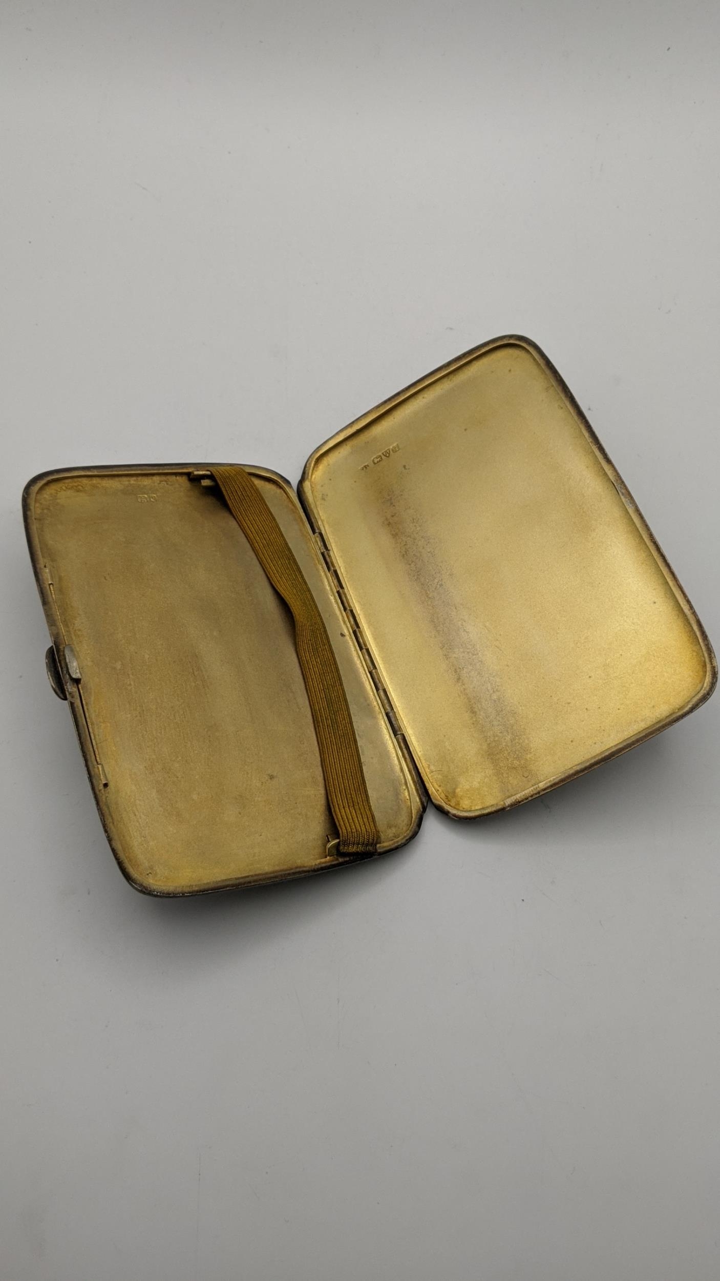A silver machine turned cigarette case 13cmH 9cmW hallmarked Chester 1926, 185.4g Location: - Image 2 of 2