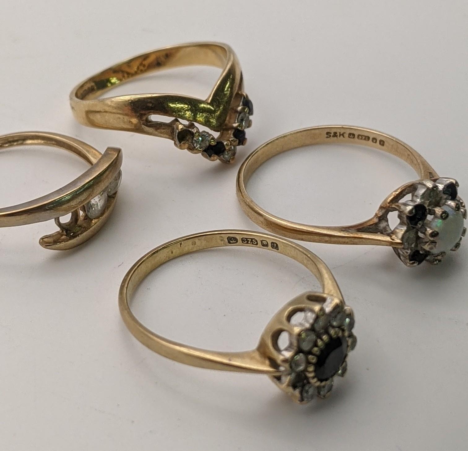Three 9ct gold rings to include one set with a central opal, diamonds and sapphires, along with a - Image 2 of 2