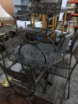 A circular garden table and four matching chairs, with a matching two-seater garden bench