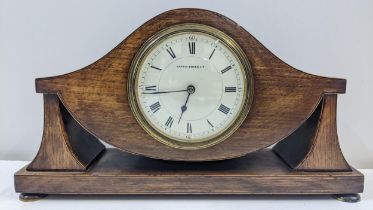 An Edwardian inlaid, oak cased mantle clock with an enamel dial, Location:
