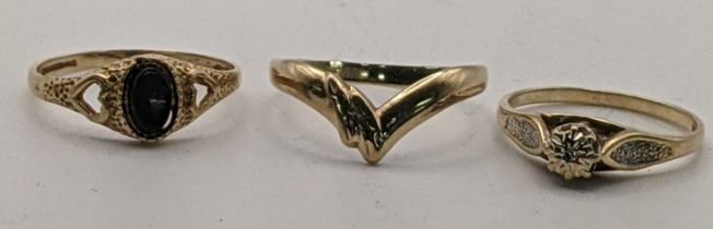A 9ct gold shaped ring and another set with a diamond and one with a black cabochon, 3.75g Location: