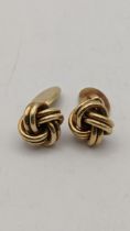A pair of gold cufflinks of knot design, stamped 585, 10.3g Location:
