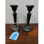 A pair of 20th century silver, weighted candlesticks, Location: