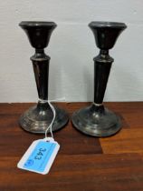 A pair of 20th century silver, weighted candlesticks, Location: