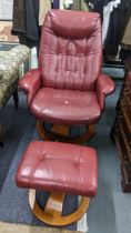 A modern Ekornes style red leather swivel armchair and matching footstool Location: