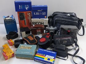 Photographic equipment to include a Pentax K1000, a Nikon L35AW, a Ricoh KR-10, lenses and