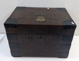 An early 20th century oak small fitted chest with a Grenadier Guards badge to the lid and wrought