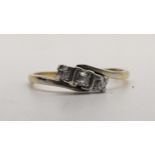 An 18ct gold ring set with three diamonds, 2.7g, Location: