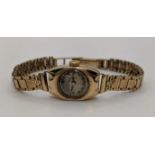 A 9ct gold cased and expandable strap ladies wristwatch, total weight 15.3g Location: