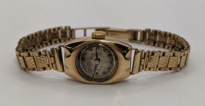 A 9ct gold cased and expandable strap ladies wristwatch, total weight 15.3g Location: