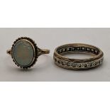 Two 9ct gold rings to include an opal ring together with a full eternity ring set with white