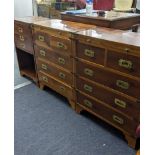 A pair of reproduction campaign yew wood five drawer chest of drawers 73cm h x 61cm w x 30.5cm d,