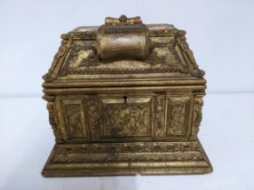 A late Victorian gilt wood jewellery casket, decorated with panels in relief of figures in various