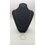 A yellow metal necklace 60cmL together with a yellow metal bracelet total weight 3.7g Location: