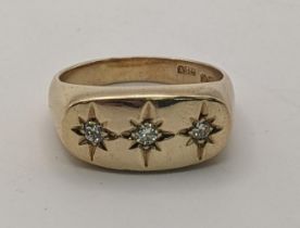 A 9ct gold and three stone diamond trilogy gypsy ring, Size U 9.8g Location: