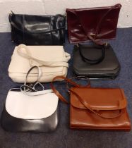 A group of mid to late 20th Century ladies bags, mainly leather, to include a Bally navy and white