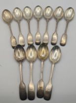 A set of eleven silver fiddle pattern tea spoons hallmarked Sheffield 1902, total weight: 333.1g