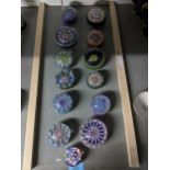 A group of Perthshire concentric millefiori and other paperweights of various sizes, along with a