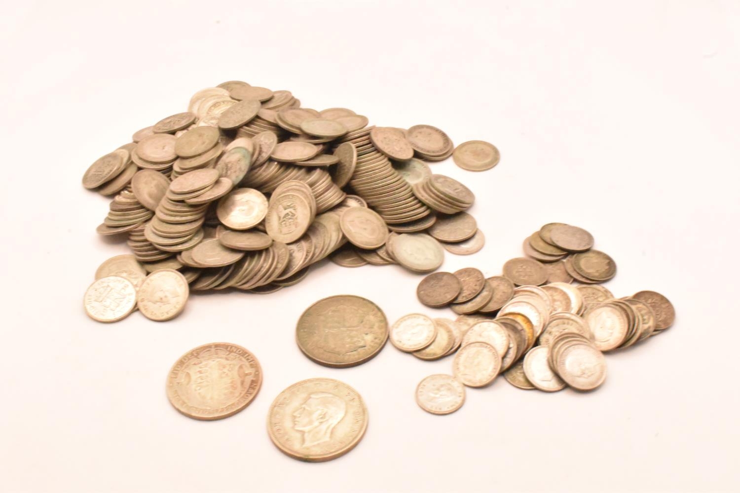 A mixed quantity of British George V and George VI pre 1947 Halfcrowns, Sixpence and Threepence,