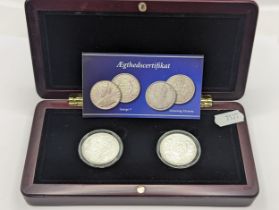 A Presentation Two-Coin Set, comprising of a George V One Rupee, and 'Dronning Victoria' One