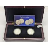 A Presentation Two-Coin Set, comprising of a George V One Rupee, and 'Dronning Victoria' One