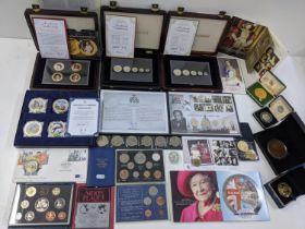 A mixed group of commemorative coins and coin sets to include 2012 Diamond Jubilee Photographic coin