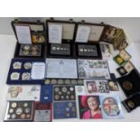 A mixed group of commemorative coins and coin sets to include 2012 Diamond Jubilee Photographic coin