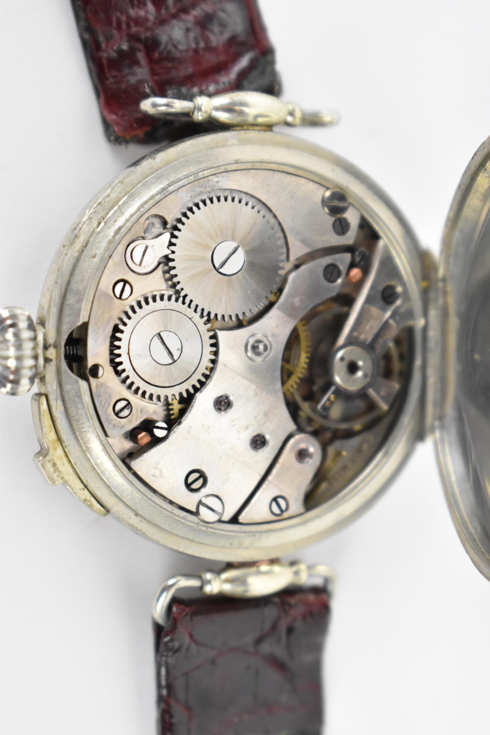 An unusual early 20th century trench style wristwatch to time a game of rugby, the white enamel dial - Image 5 of 5