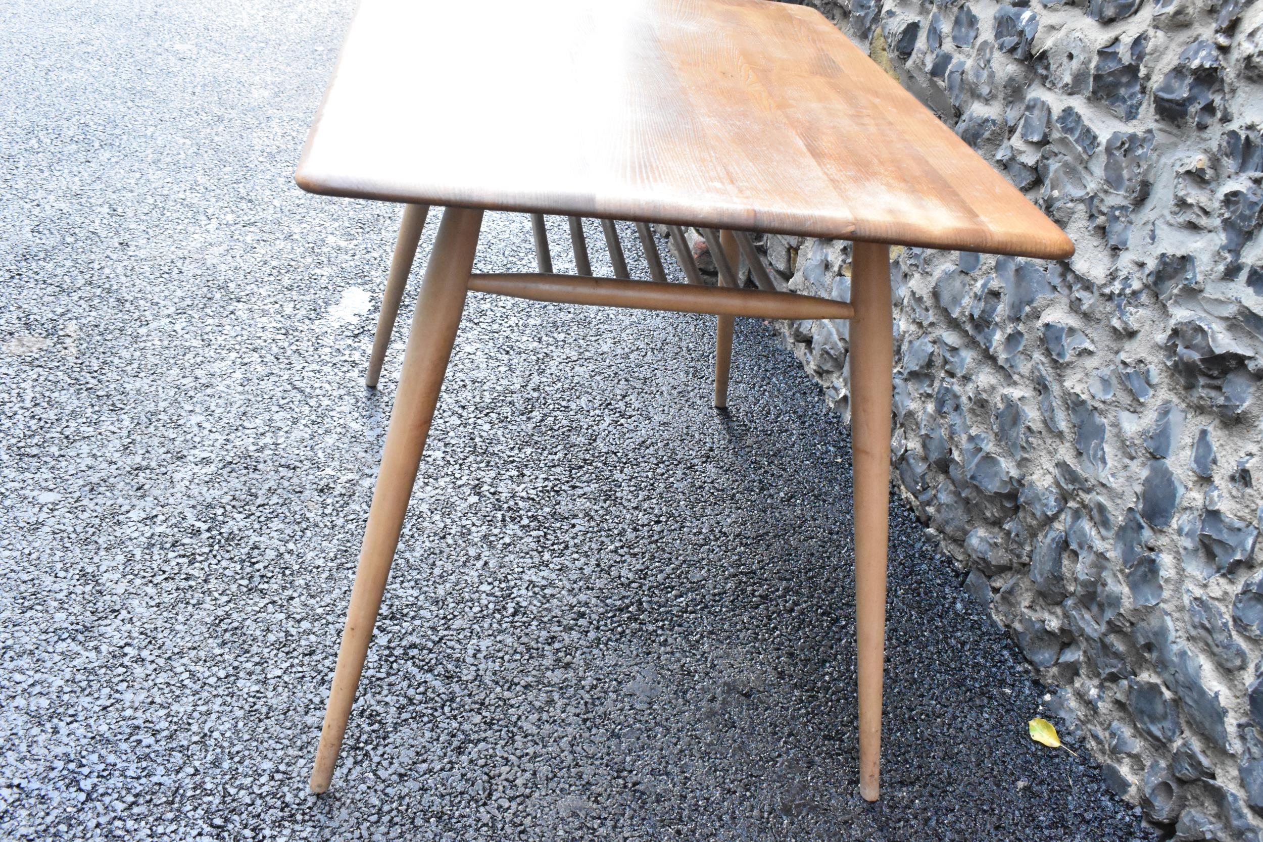 A 1960s Ercol blonde elm and beech breakfast table, model 395, having a rectangular top with a - Image 5 of 6