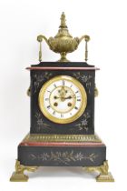 A late 19th century French marble mantle clock, the case having gilt metal urn finial and applied