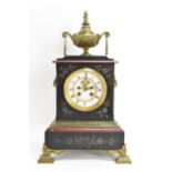 A late 19th century French marble mantle clock, the case having gilt metal urn finial and applied
