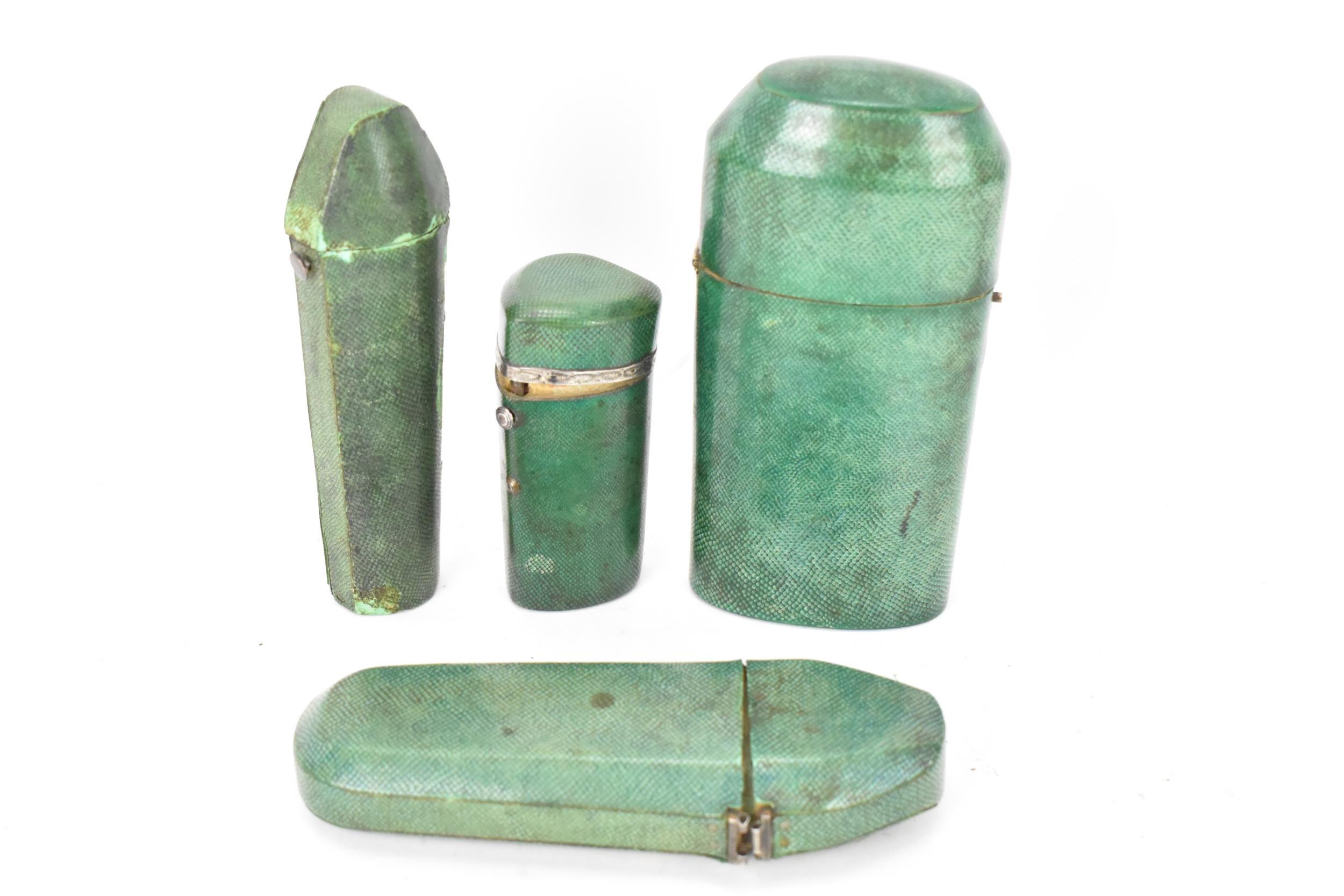 Four late 19th century shagreen items with hinged lids to include a pin cushion, two scent bottle