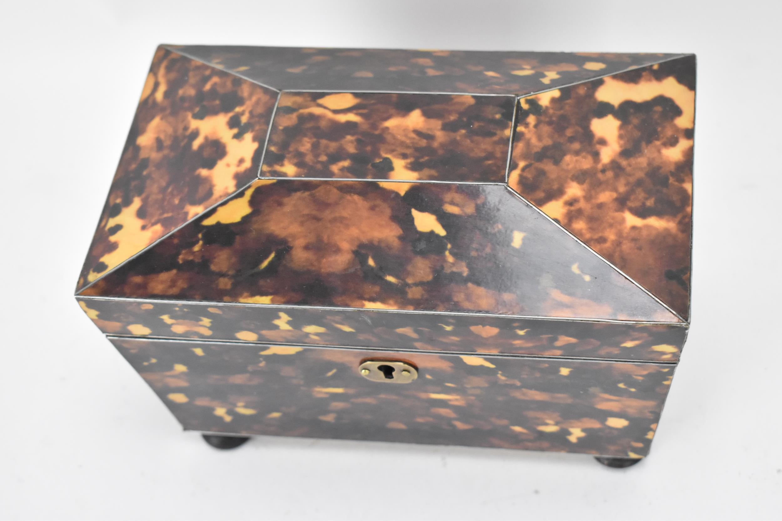 A late 20th century printed tortoiseshell pattern, twin compartment tea caddy, of sarcophagus form - Image 2 of 8