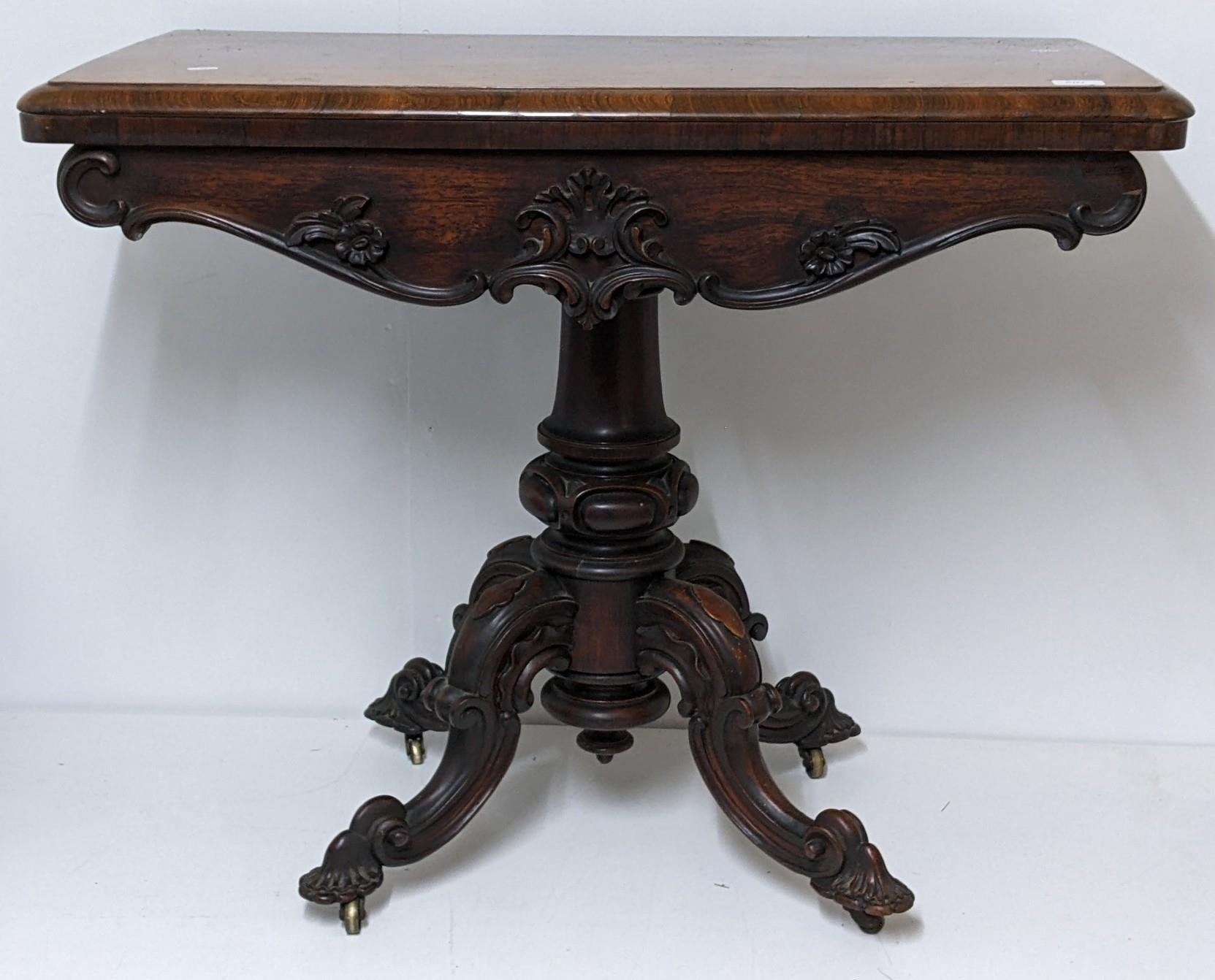 ***THIS LOT HAS BEEN WITHDRAWN***A Victorian rosewood fold over card table having a green baize
