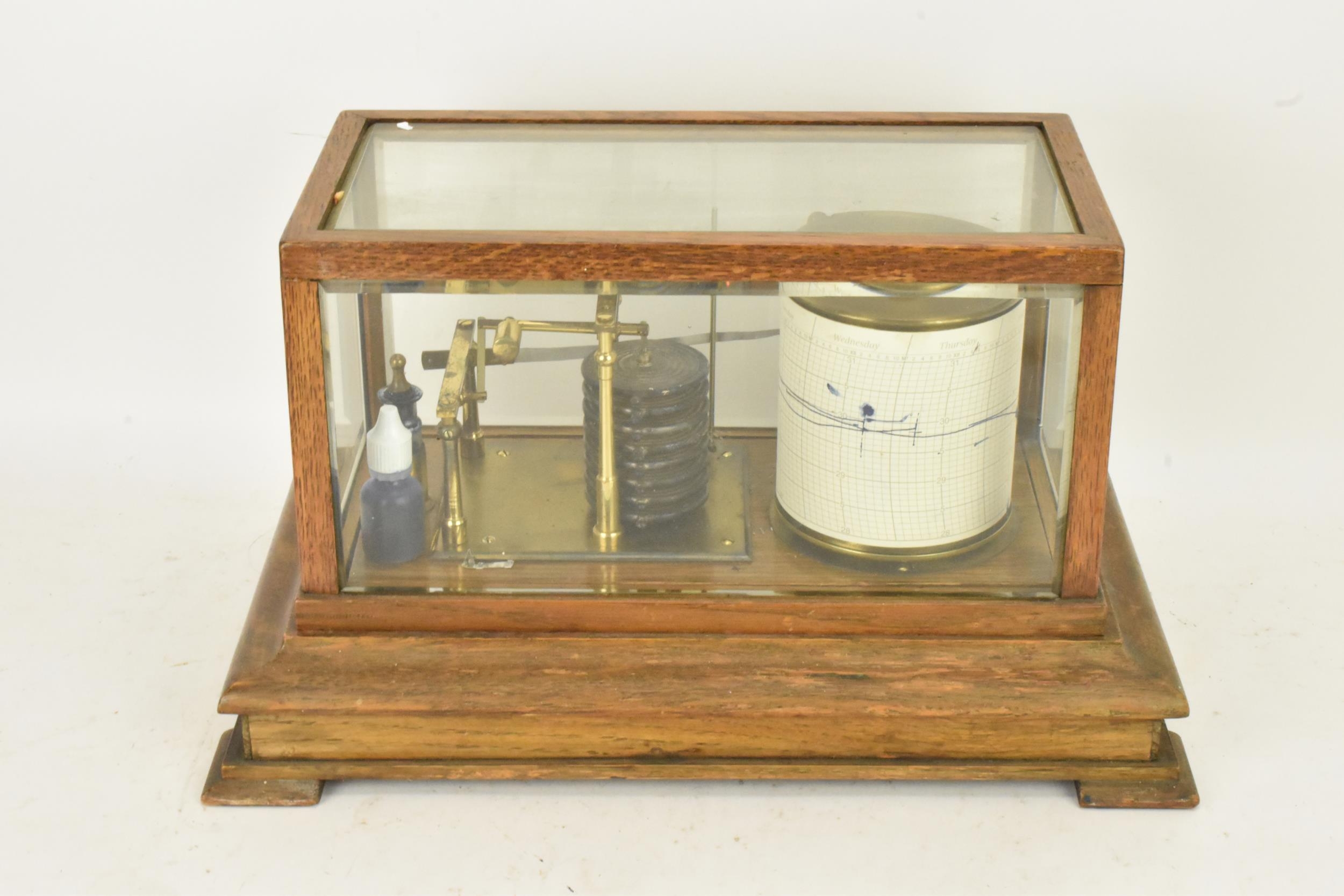 An early 20th century barograph, the oak case with bevelled glass and chart drawer, labelled 'J Beck - Image 5 of 7